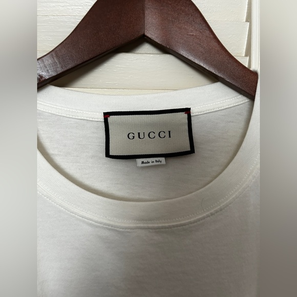 white t-shirt with red lettering. - Picture 3 of 3